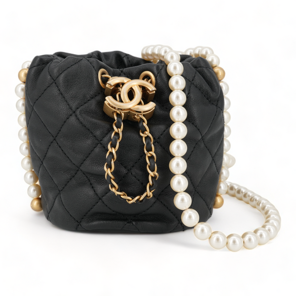 CHANEL Pearl Chain Drawstring Mini Bucket Bag in Black Lambskin - Replica Handbags Shopping
.com