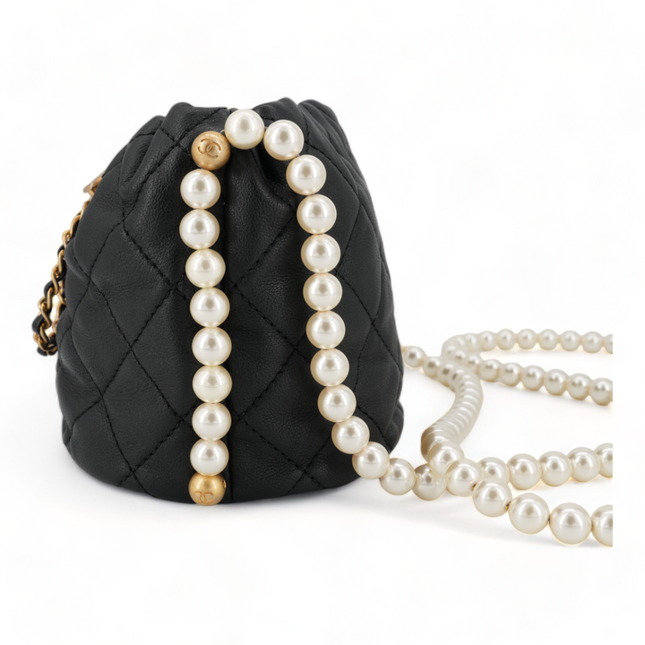 CHANEL Pearl Chain Drawstring Mini Bucket Bag in Black Lambskin - Replica Handbags Shopping
.com