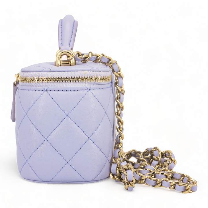 CHANEL Mini Vanity Case with Top Handle in 21K Lilac Lambskin - Replica Handbags Shopping
.com